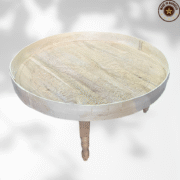 Round wood coffee table handcrafted from Moroccan cedar with carved detailing