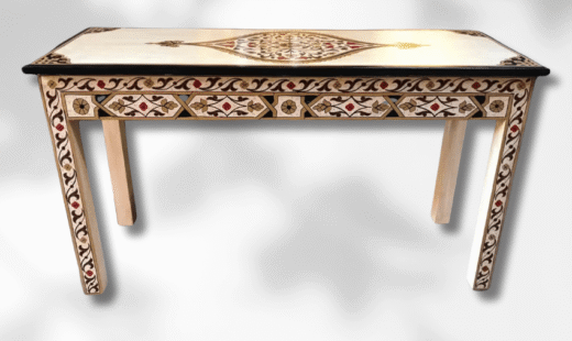 Handcrafted Moroccan console table in carved wood placed in an entryway setting