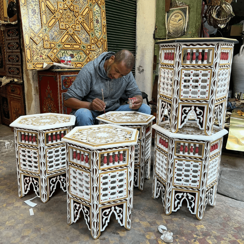 Craftsman painting an Hexagon Coffee Table